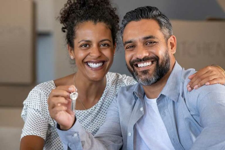 happy couple with house keys